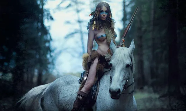 Young brave on a white horse